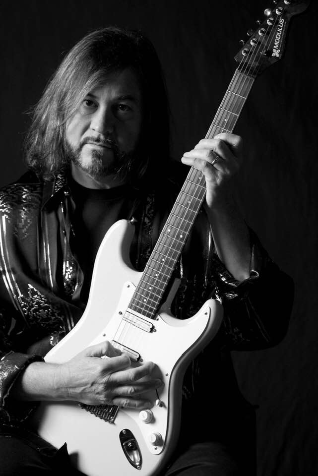 Kenny Lee Lewis portrait with guitar